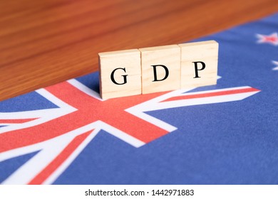 Gross Domestic Product Or GDP Of Australia In Wooden Block Letters On Australian Flag