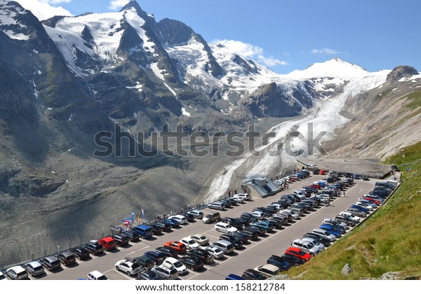 GROSSGLOCKNER - AUGUST 16: car park overlooking the\
Pasterze Glacier and the Grossglockner, Austria on August 16, 2013.\
The glacier has decreased in size by half since 1851 due to global\
warming. 