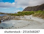 Grotlesanden Beach in Grotle, Norway, ocean, sandy shores, mountains.