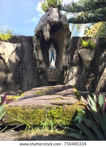 grotto statue mother mary incorporated on stock photo (edit nowa grotto with a statue of the mother mary incorporated on the perimeter wall of a