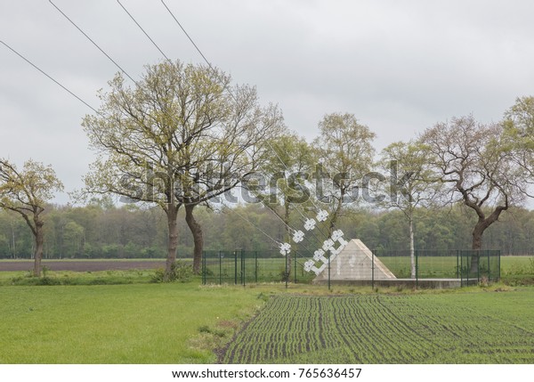 Ground\
anchor with cables - TV tower in the\
Netherlands