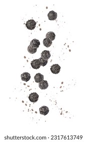 Ground black pepper (peppercorn) falling isolated on white background