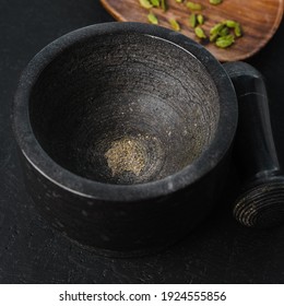 Ground Cardamom In A Stone Frame On A Black Background