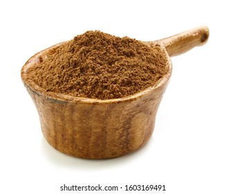 Ground Cinnamon In Wooden Cup Isolated On White Background