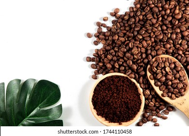 Ground coffee and coffee beans on white background.