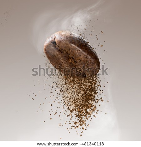 Ground coffee falling from the bean
