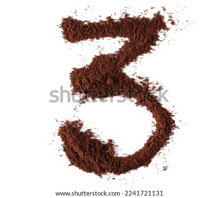 Ground coffee in shape number 3, three isolated on white, clipping path