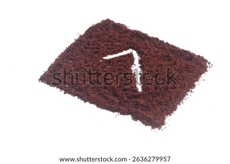 Ground coffee in shape square wrote latter 7 isolated on white background