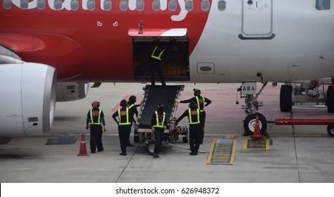 Ground Crew In Airport Checking Completed Before Departure,Airline Staff Checking Completed Before Serving Customers.