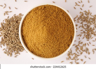 Ground Cumin In A Bowl  And Whole Cumin