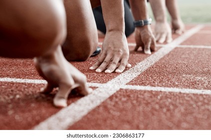 Ground, hands and people ready for a race, running competition or training at a stadium. Fitness, sports and athlete runners in a line to start a sprint, exercise or challenge in track or athletics - Powered by Shutterstock