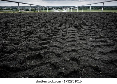 Ground Level View Of A Gallop And Horse Racing Track Seen At The Top Of The Hill. Continuing To The Distance, Towards An English Market Town.