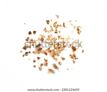 Ground, milled, crushed, Chopped pecan nuts isolated on white background