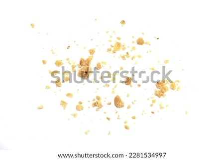 Ground, milled, crushed or granulated hazelnut pile isolated on white background