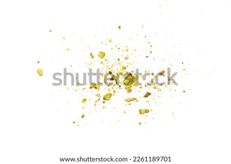 Ground, milled, crushed or granulated pistachio pile isolated on white background