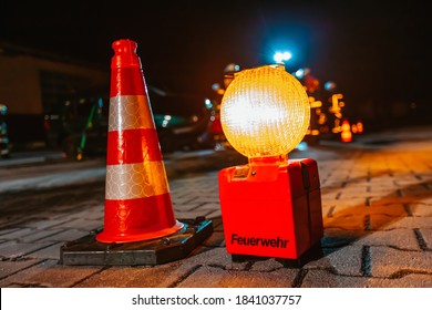 Ground Obstruction Light Stands Near An Accident. FEUERWEHR Is The German Word For Fire Department