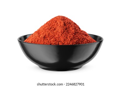Ground red pepper in black bowl isolated on white background. Front view.