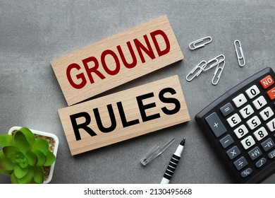 Ground rule. text on wooden sides on a gray background