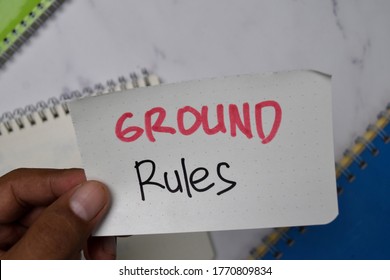 Ground Rules Text On Sticky Notes Isolated On Office Desk.