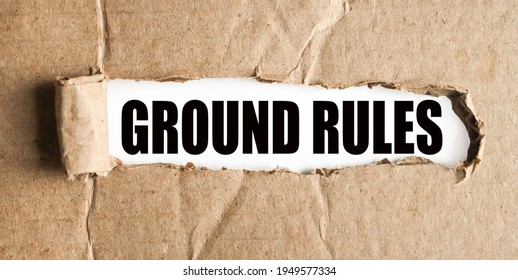 Ground Rules. Text On White Paper Over Torn Paper Background.