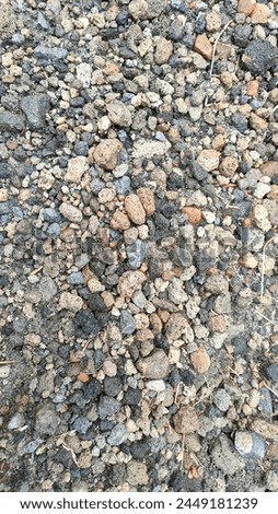 Ground stone gray background of many small stones
