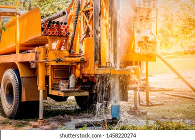 Ground water hole drilling machine installed on the old truck in Thailand. Worker keeping an eye on Ground water well drilling. Ground water well drilling. - Shutterstock ID 1458220274