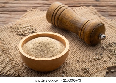 Ground White Pepper In Wooden Bowl On Wood Table