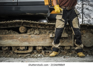 Ground Works Bulldozer Operator In Front Of His Crawler. Heavy Construction Equipment Job Theme.