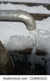 The Groundwater Flowing From A Frozen Outdoor Water Tap