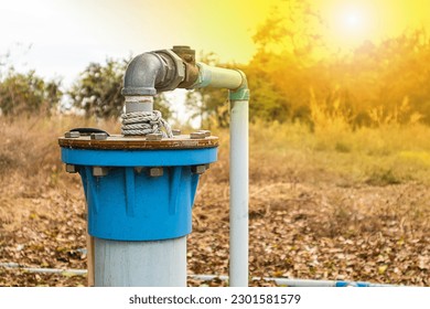 Groundwater wells are drilled and water is supplied with PVC pipes, groundwater pumping systems are powered by electricity to solve drought problems. - Powered by Shutterstock