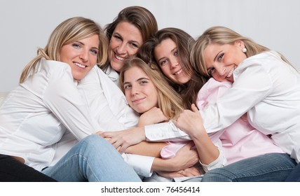 A Group Of 5 Happy Women Of Different Ages Cuddling