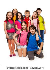 Group Of 8 Kids Standing Together With Backpacks, Smiling, Laughing, On White