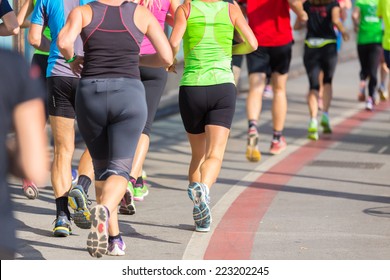 Group Of Active People Running In The City. Healthy Lifestyle. Weight Loss. Urban Marathon Run.