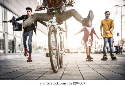 Group of active teenagers in town. four teens making recreational activity in an urban area