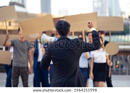 Group of activists with banners protesting to democracy and equality. Men and women doing a silent protest for democracy and equality