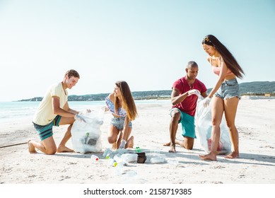 Group Of Activists Friends Collecting Plastic Waste On The Beach. People Cleaning The Beach Up, With Bags. Concept About Environmental Conservation And Ocean Pollution Problems