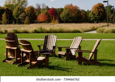 Group of Adirondack Chairs in Foreground of a Picturesque Park Landscape - Shutterstock ID 734466763