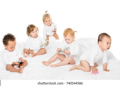 Group Of Adorable Multicultural Toddlers With Cash And Credit Cards Isolated On White