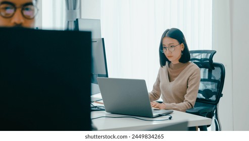 Group Adult Asia male, female freelance typing write prompt AI bot IT app smart program nomad, video game, terminal with coding language, user interface, designer, big data center on desktop computer. - Powered by Shutterstock