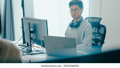 Group Adult Asia male, female freelance typing write prompt AI bot IT app smart program nomad, video game, terminal with coding language, user interface, designer, big data center on desktop computer. - Powered by Shutterstock