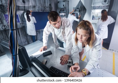 Group Of Adults Trying To Get Out Of Escape Room Stylized Under A Laboratory 