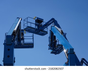 Group of aerial work platforms for construction and material handling. Close-up to the basket for moving people