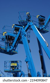 Group of aerial work platforms for construction and material handling. Close-up to the basket for moving people