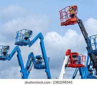 Group of aerial work platforms for construction and material handling. Close-up to the basket for moving people