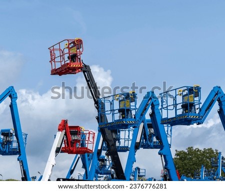 Group of aerial work platforms for construction and material handling. Close-up to the basket for moving people