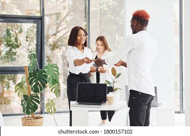 Group Of African American Business People Working In Office Together.