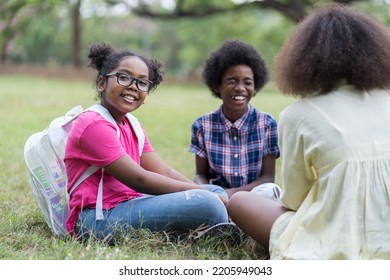 Group of African American children learning outdoor in the park. Diversity black people learning outside the classroom. Kids field trips outside. Kids and educational concept - Powered by Shutterstock