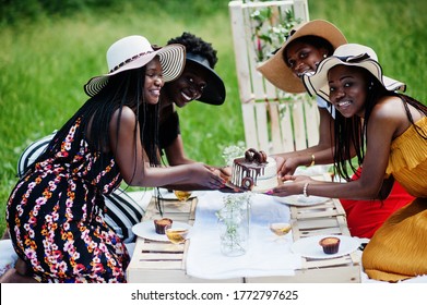 Group Of African American Girls Celebrating Birthday Party And Hold Cake Outdoor With Decor.