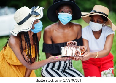 Group Of African American Girls With Facial Masks Celebrating Birthday Party Outdoor With Decor During Coronavirus Pandemia.