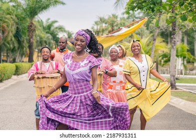 A Group of African American people dancing and playing Latin music. - Shutterstock ID 2187931311